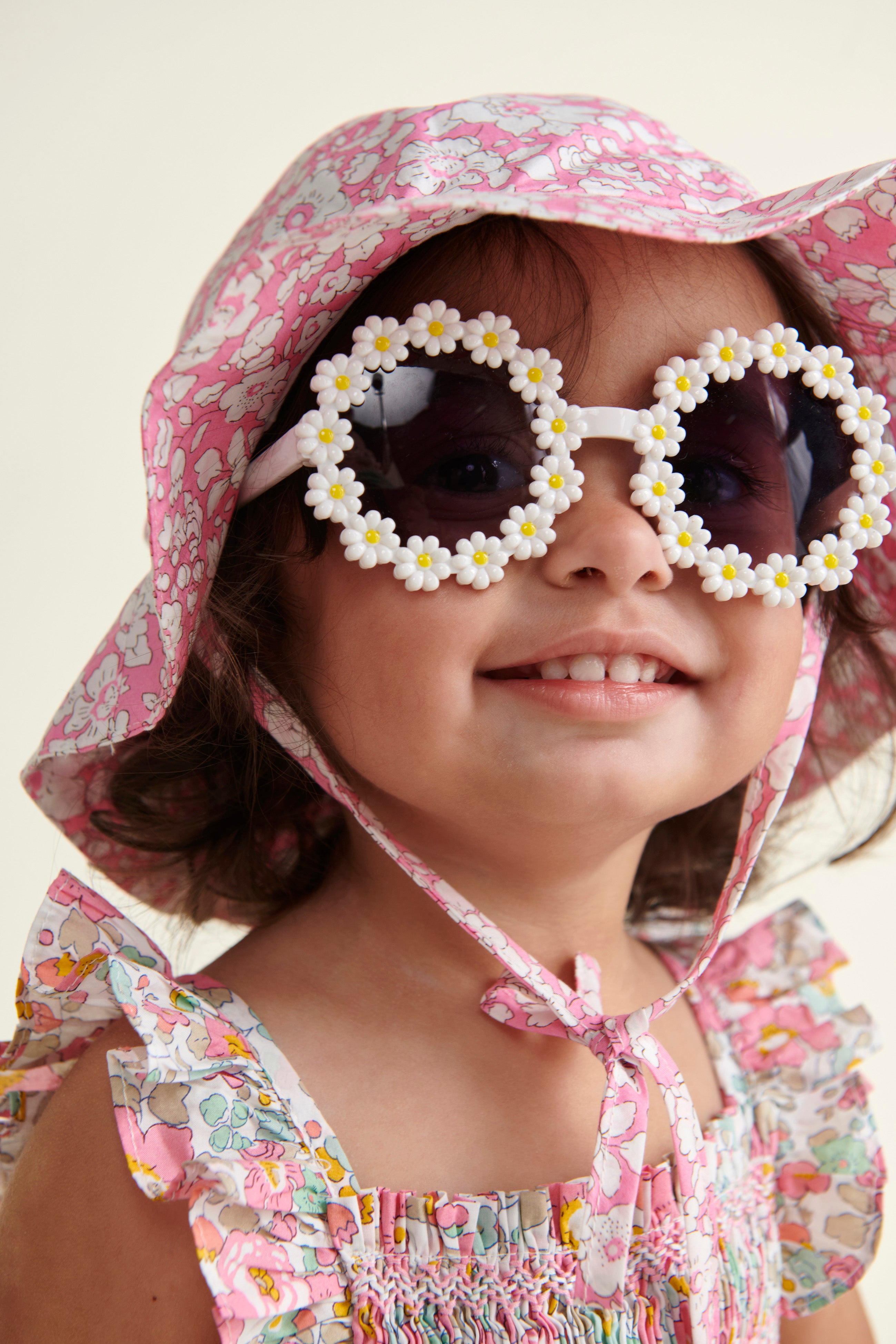 Liberty print sun hat worn by baby