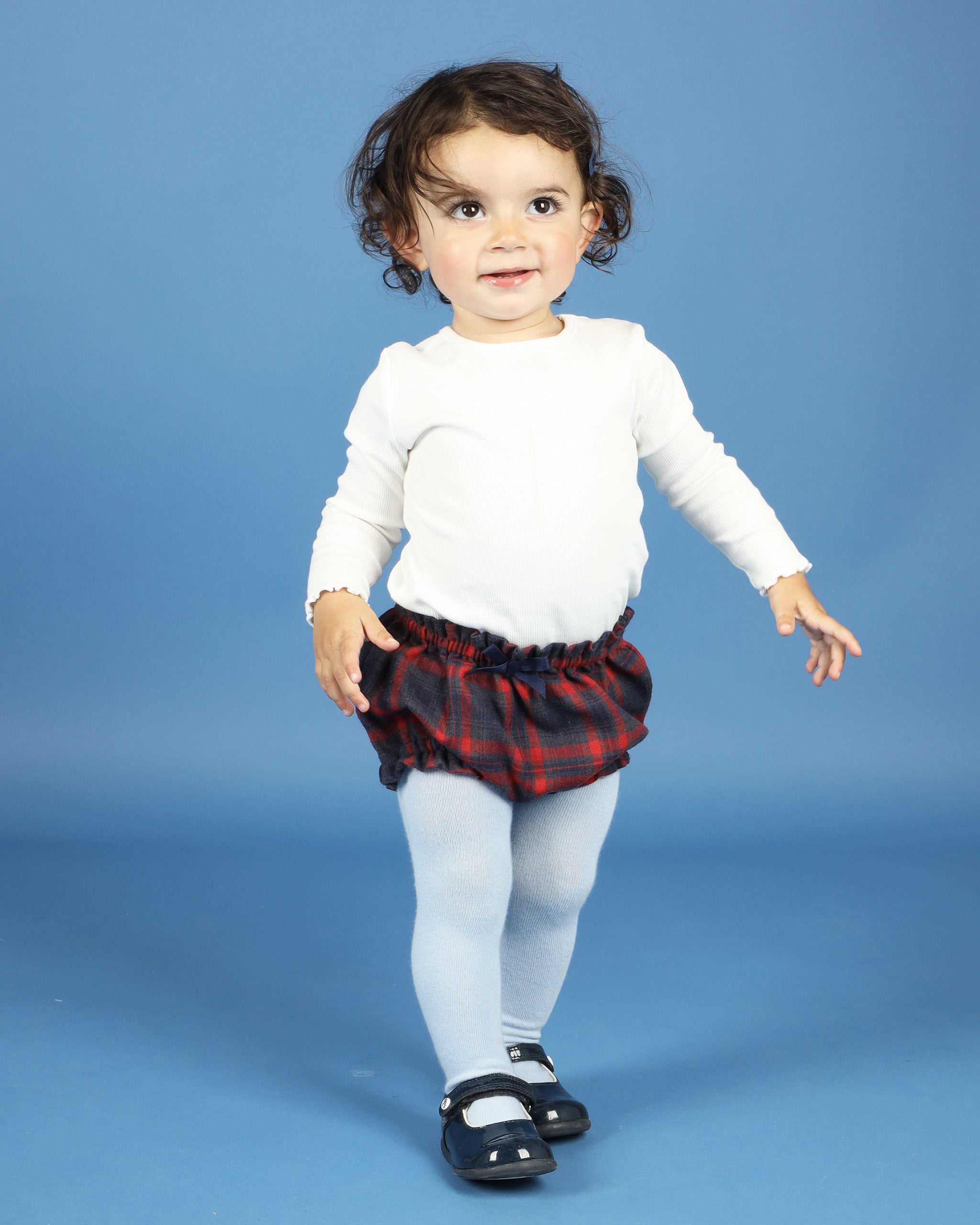 Baby in Tartan shorts with bow