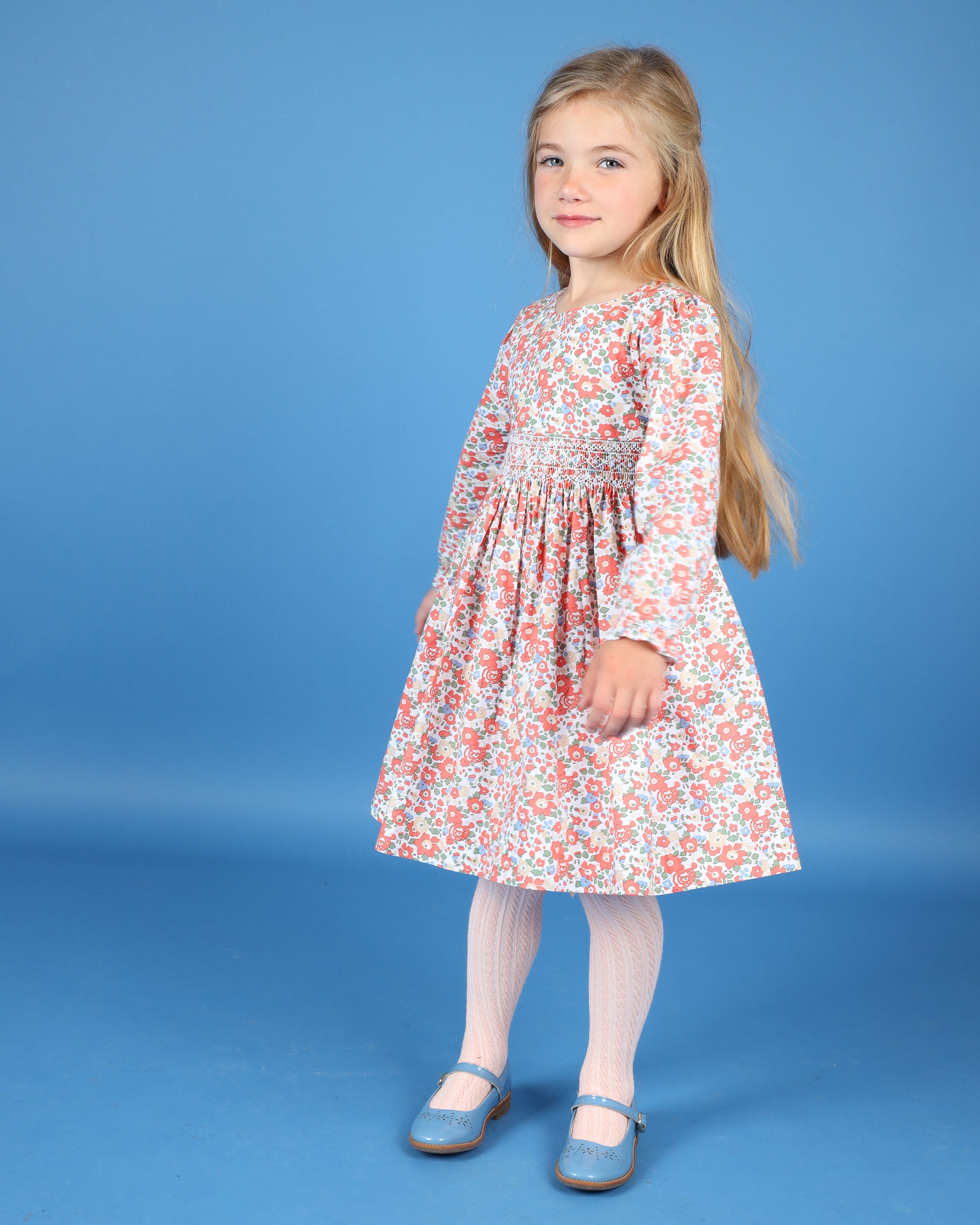 girl in hand smocked cotton floral dress