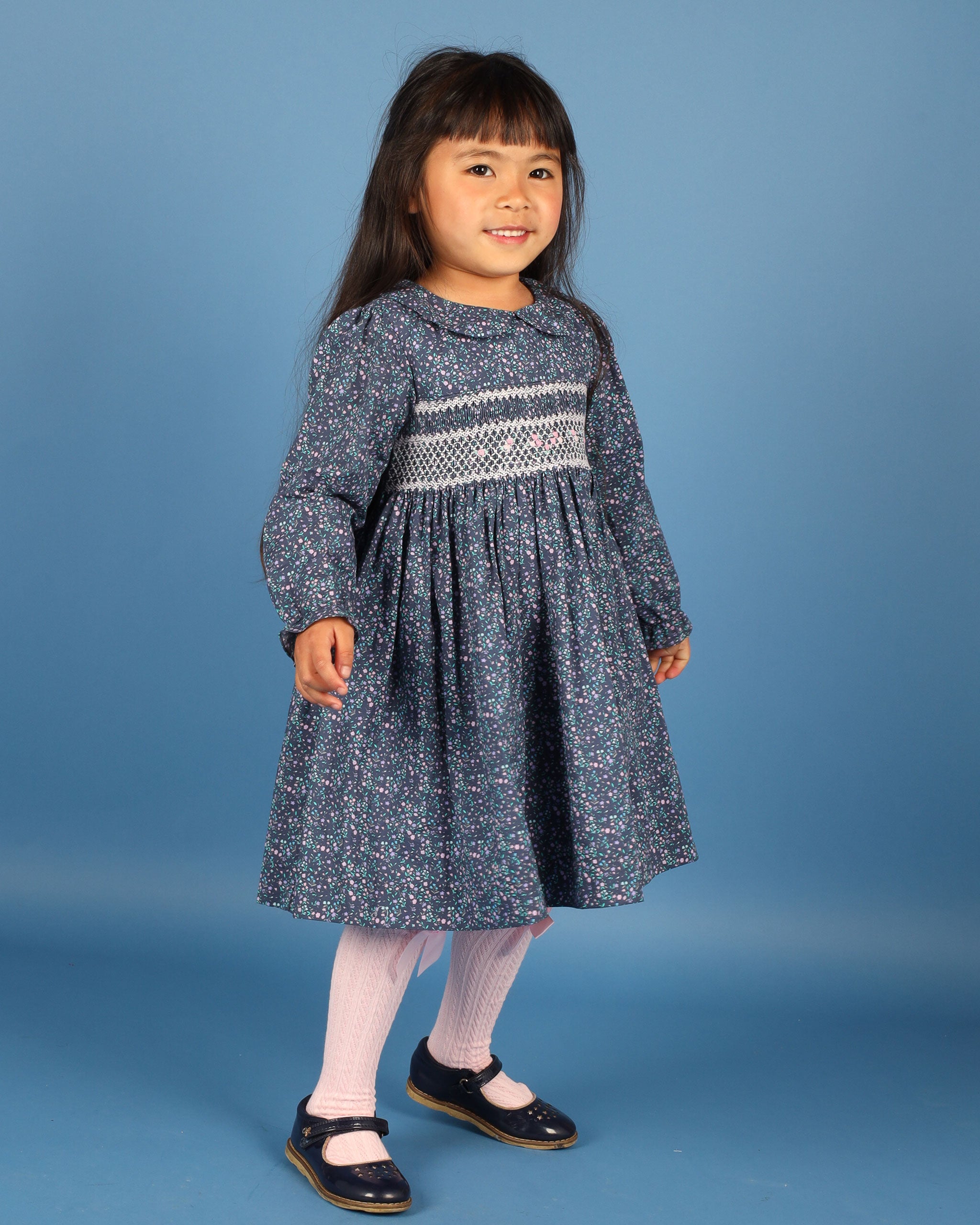 girl in  nave dress with smocking