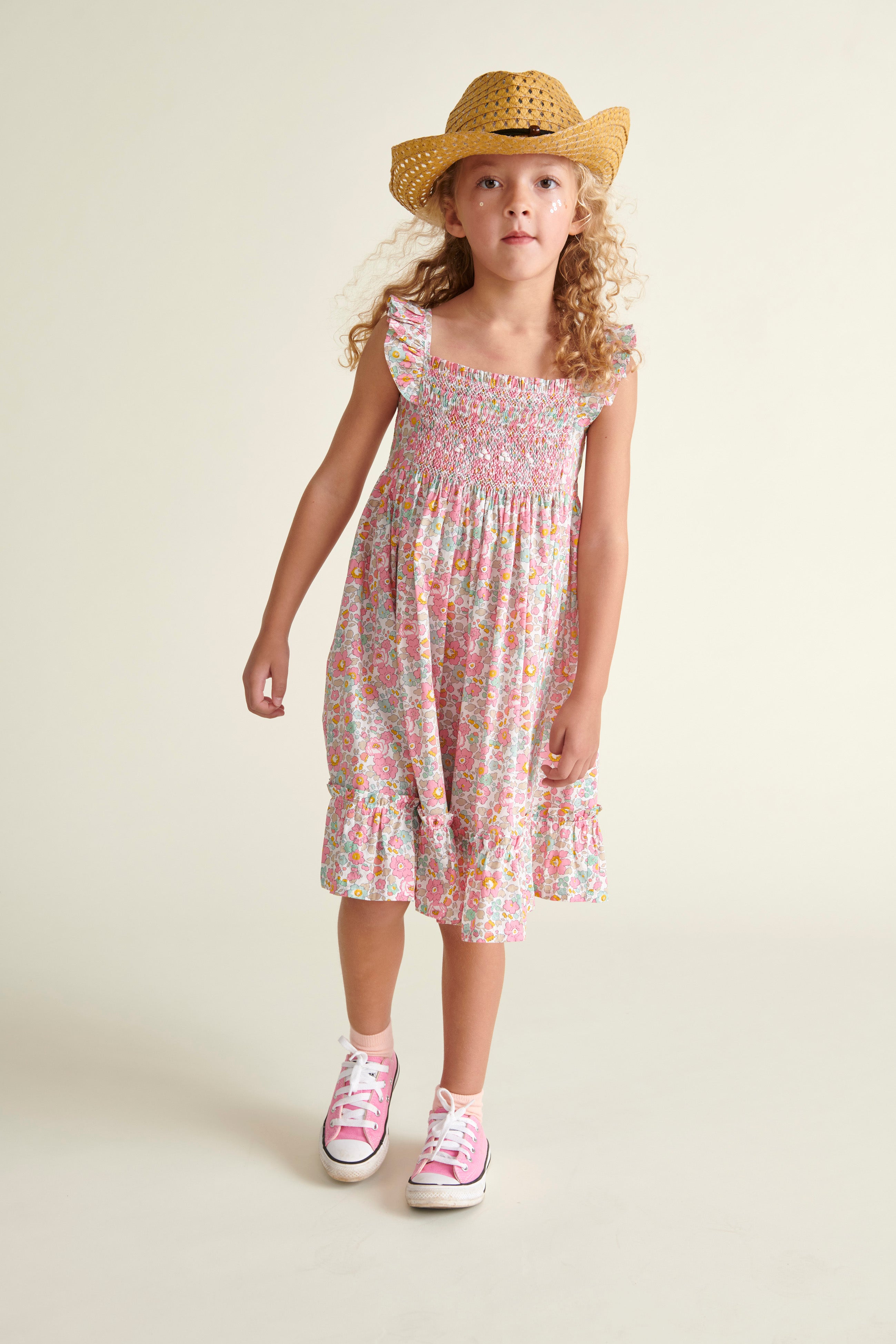 girl in smocked sun dress, made from Liberty fabric