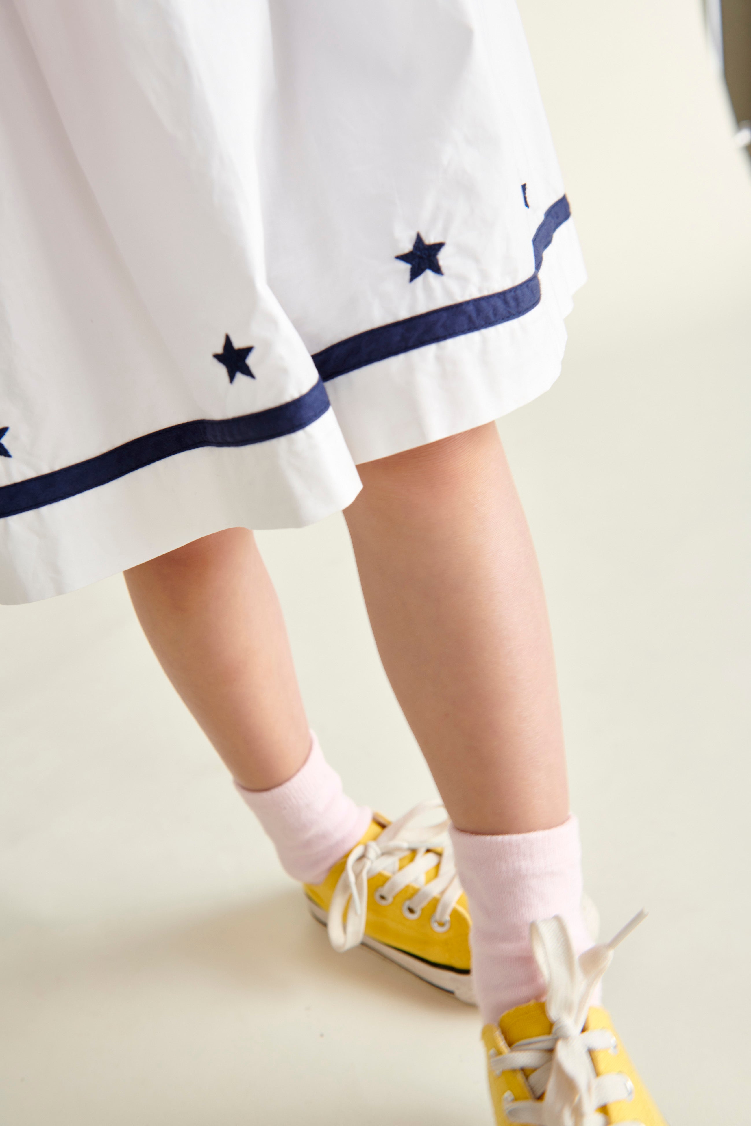 star embroidery on white sailor dress