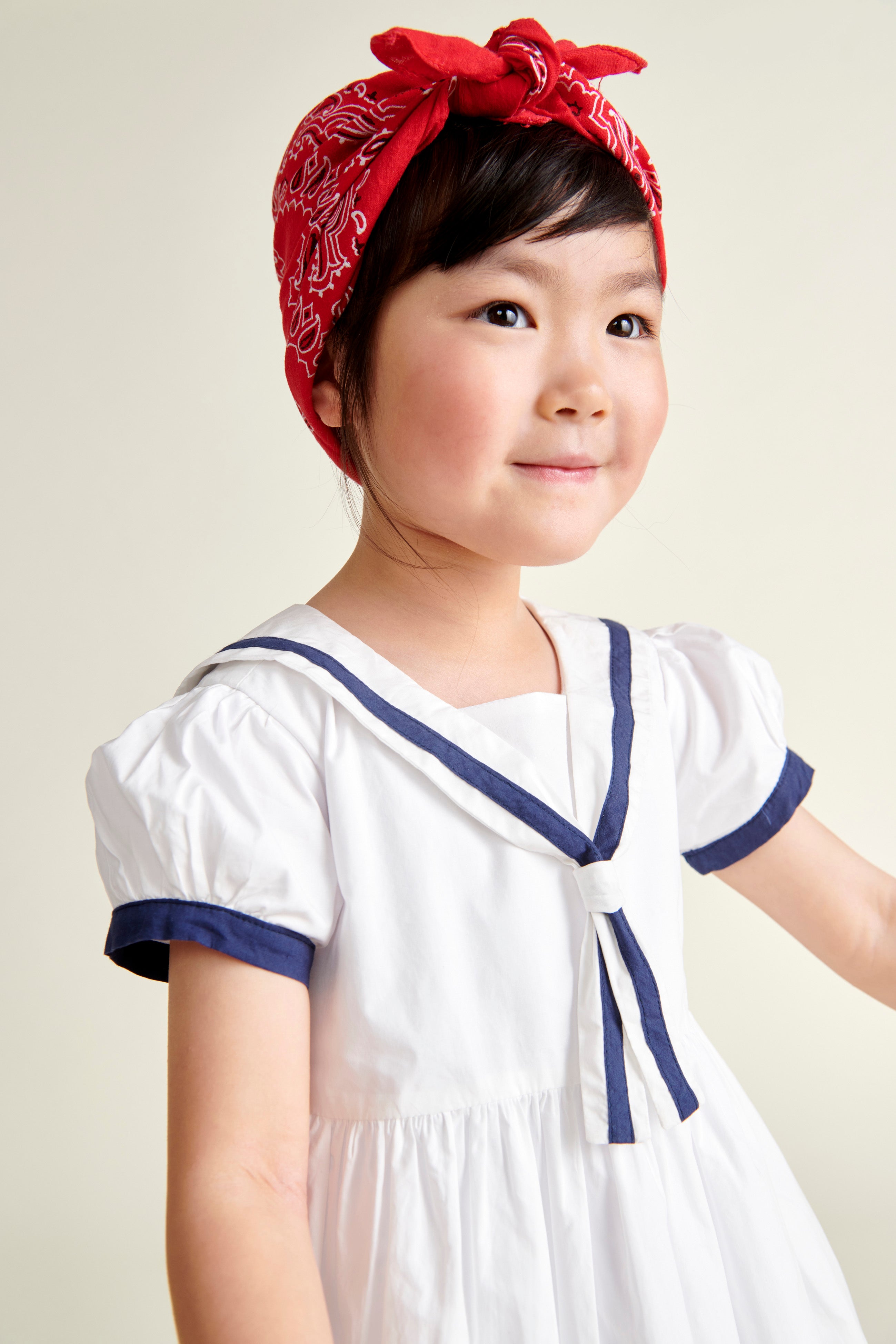 girl model in white and navy sailor dress