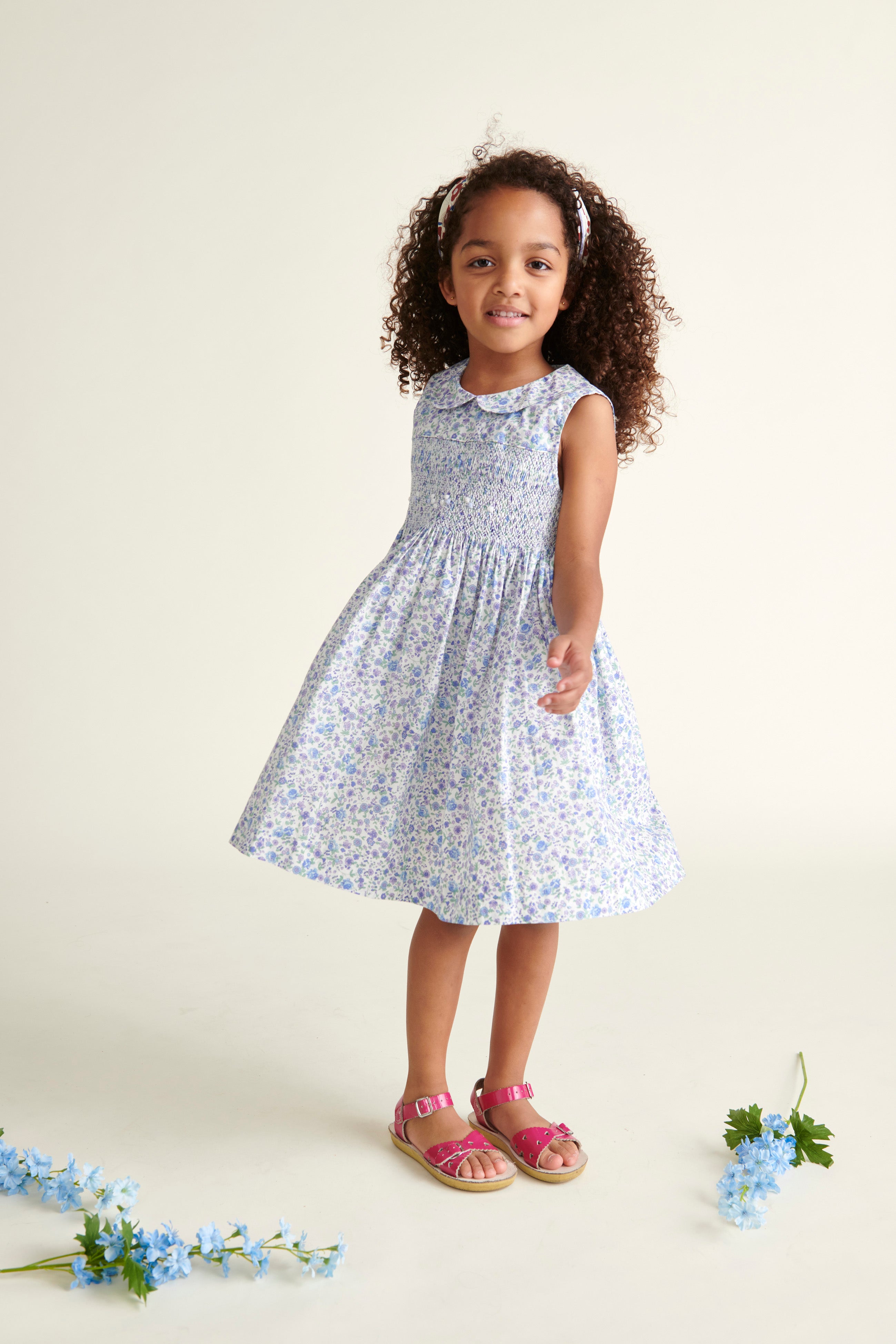 girl twirling in smocked dress