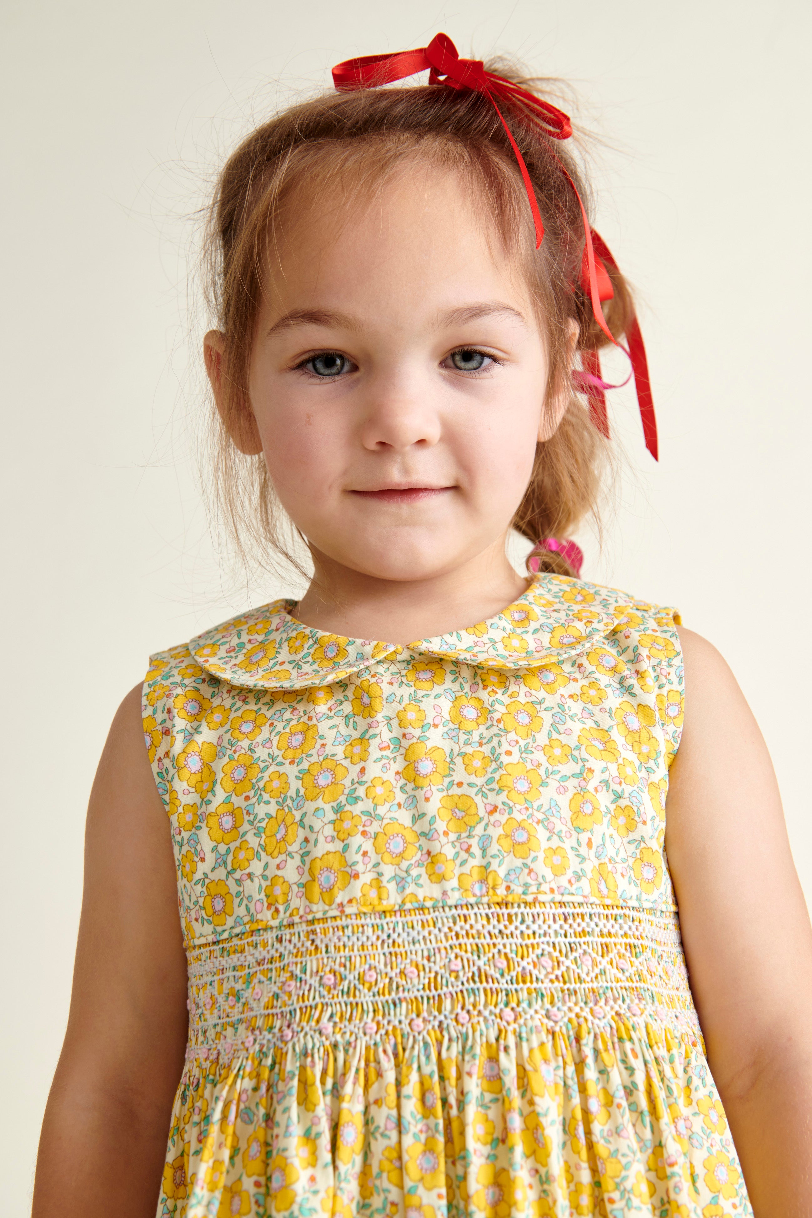 girl in hand-smoked yellow Easter Dress