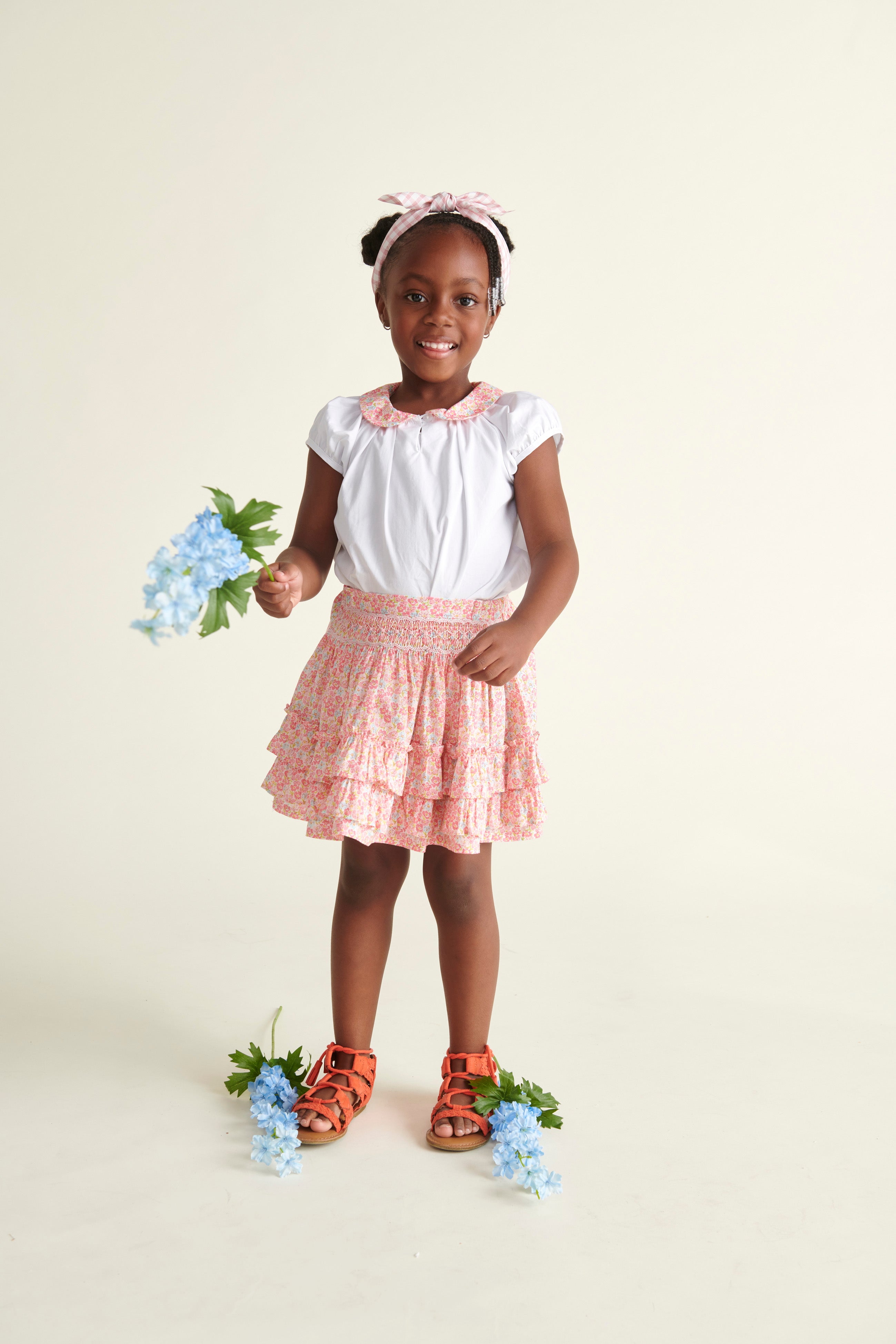 girl in smocked skirt and blouse 