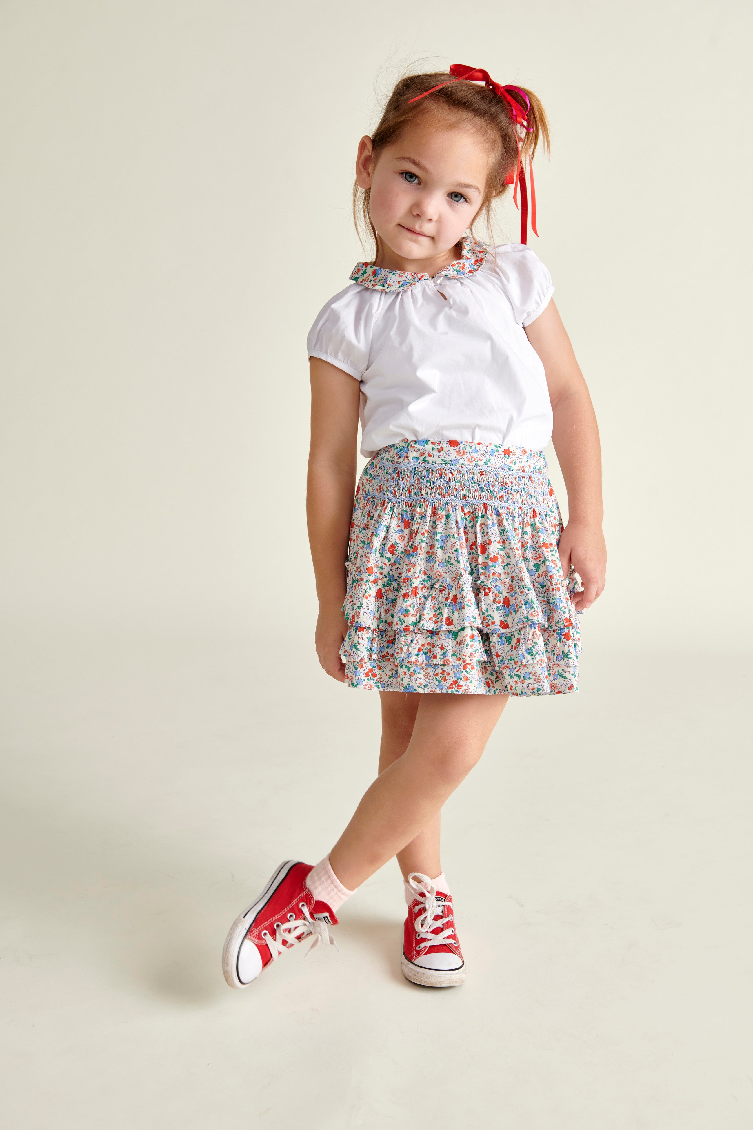 girl in ruffle skirt and pretty blouse