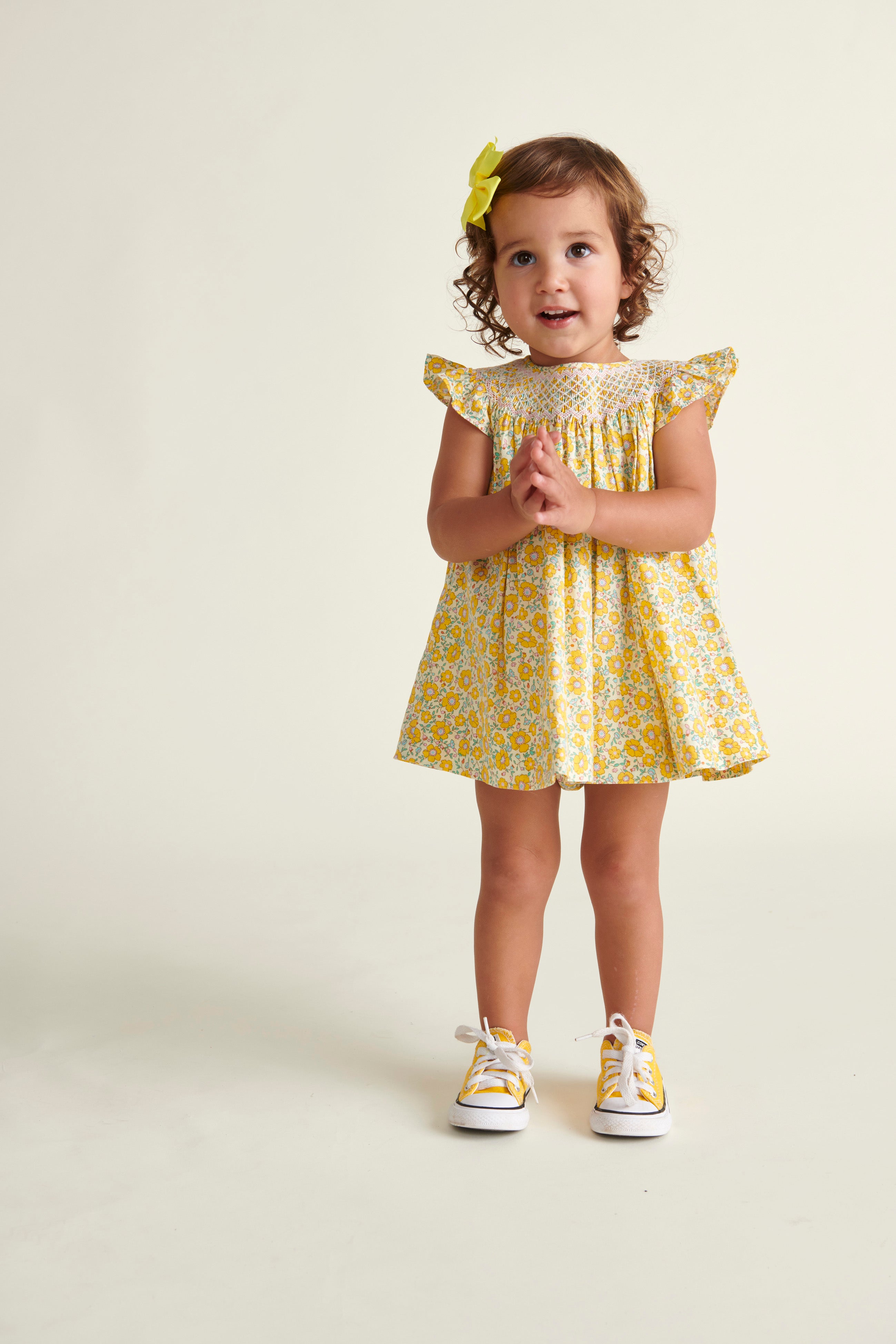 girl in yellow floral dress