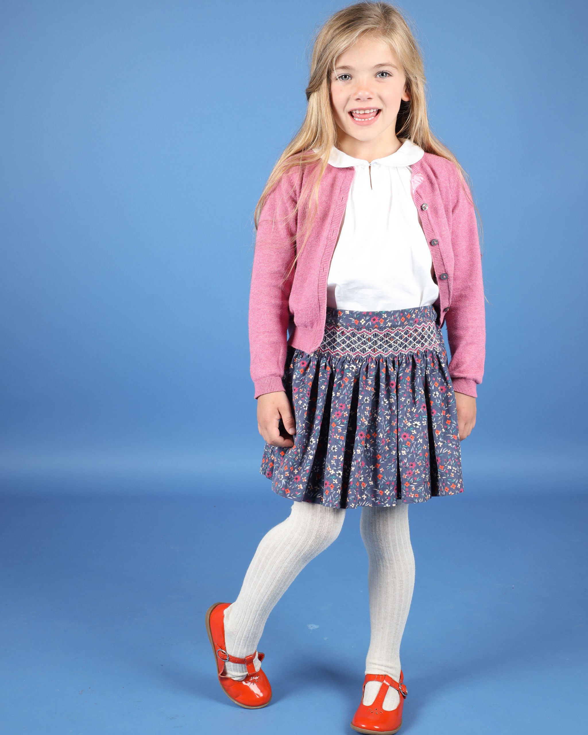 girl in smocked corduroy skirt