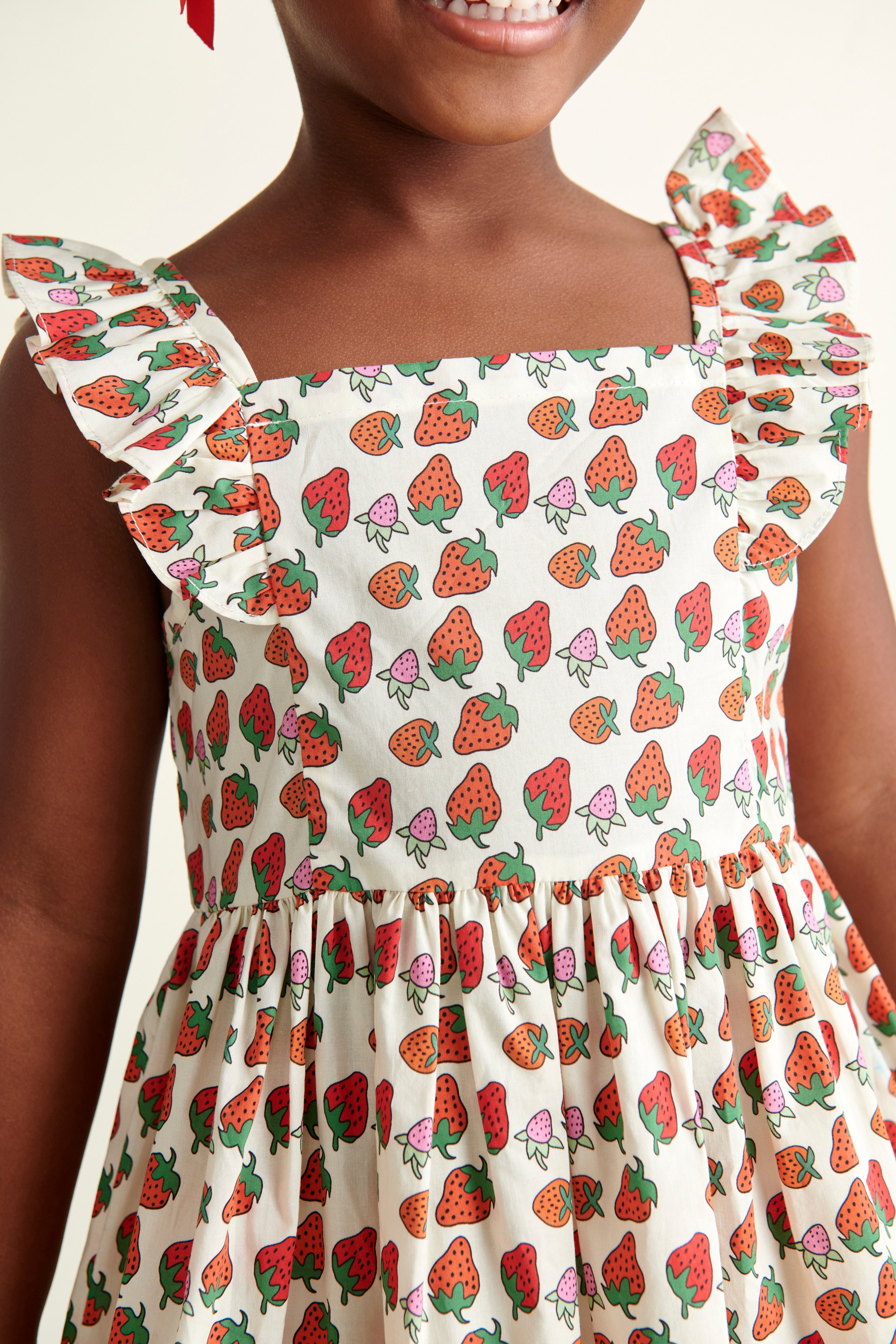 closeup of strawberry print dress