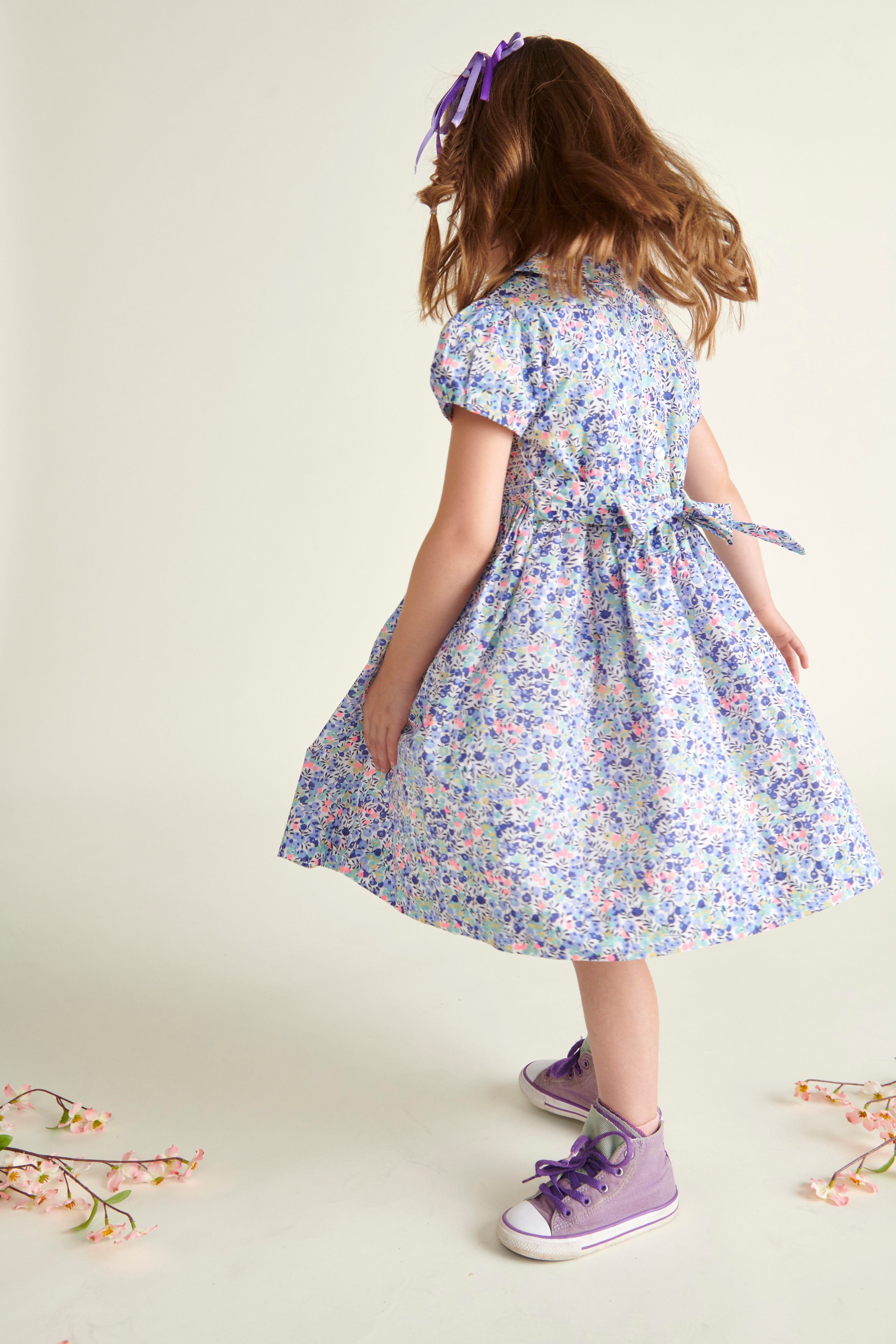 girl twirling in smocked dress