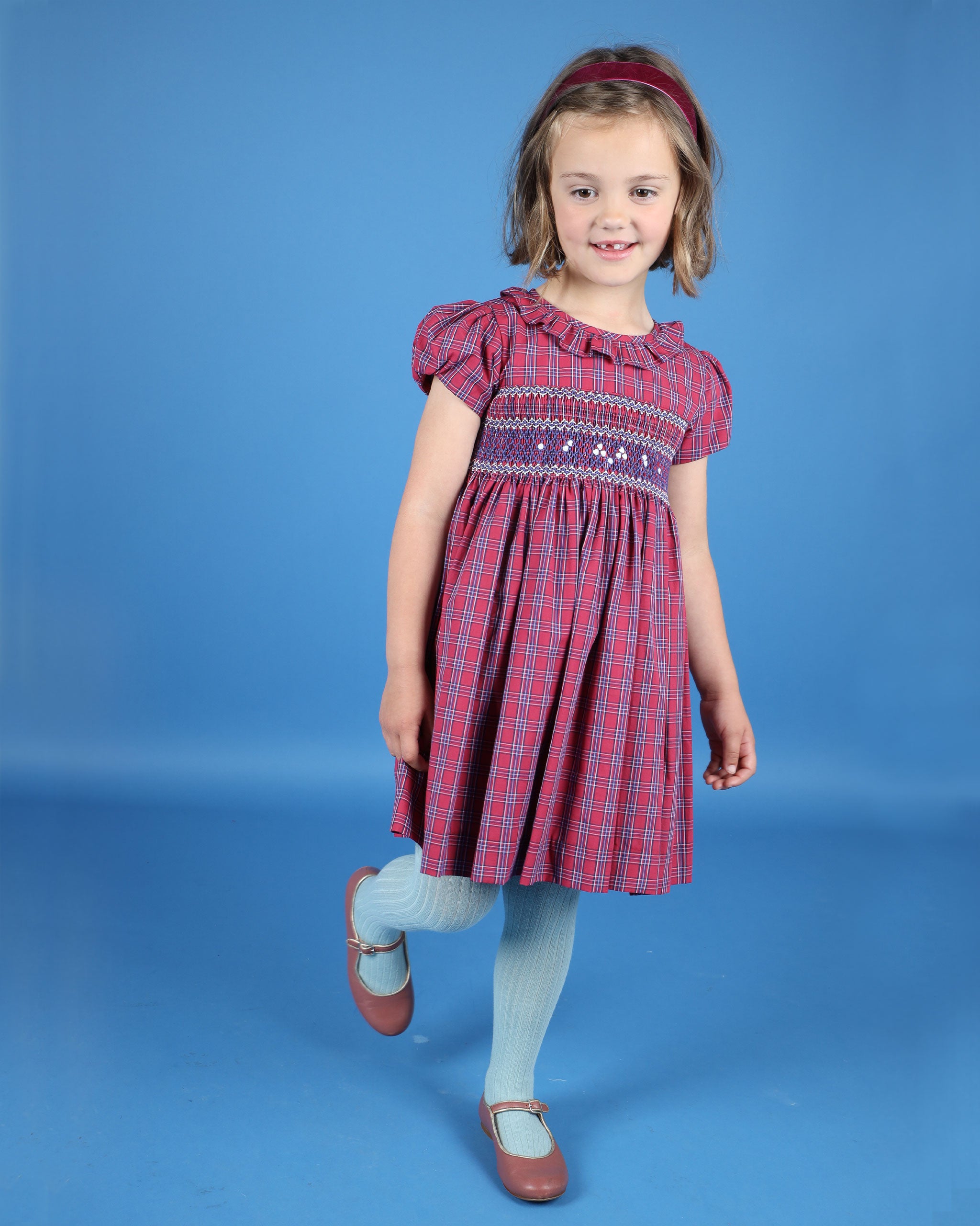 girl in smocked dress, red tartan