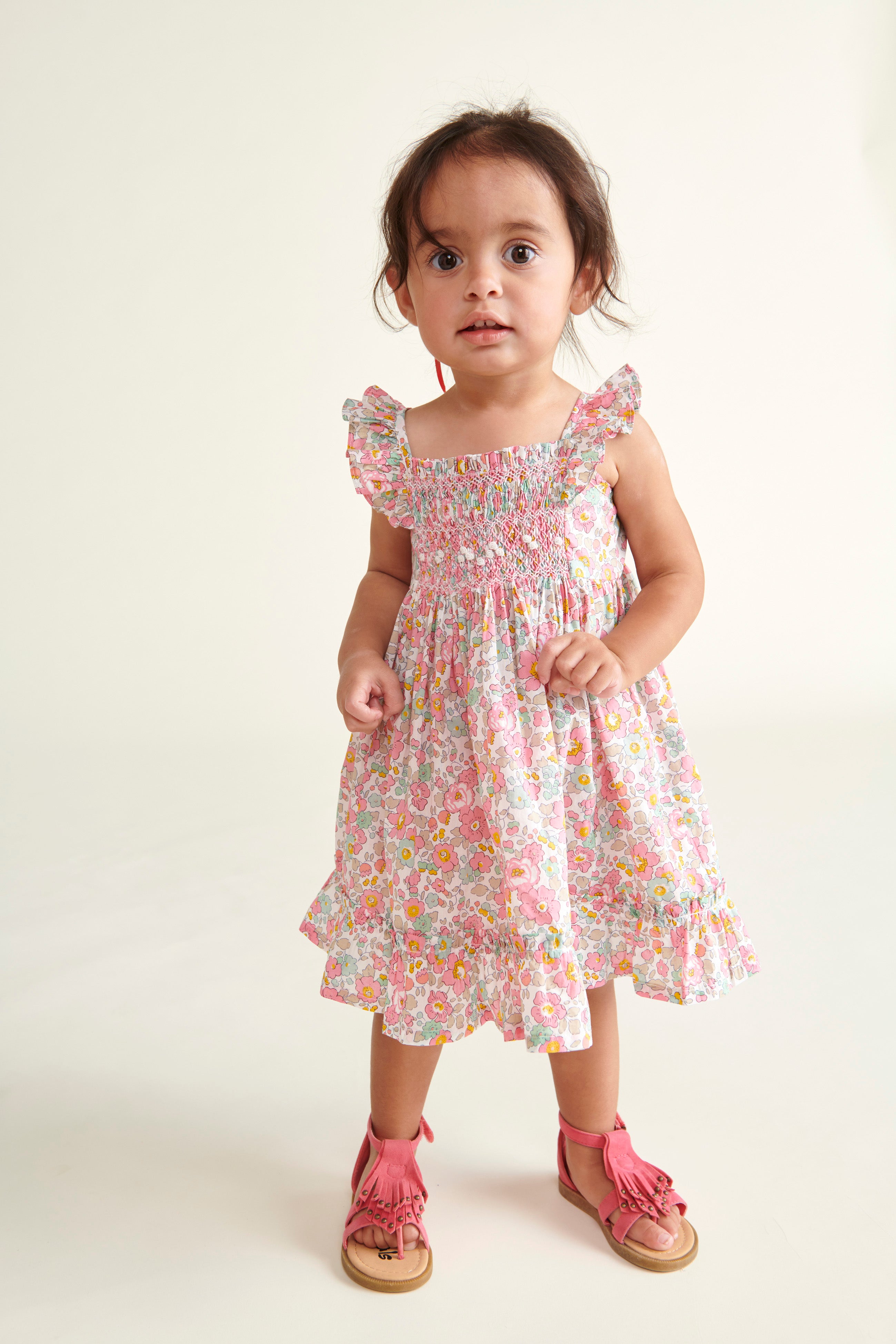 toddler model in Liberty print sun dress,