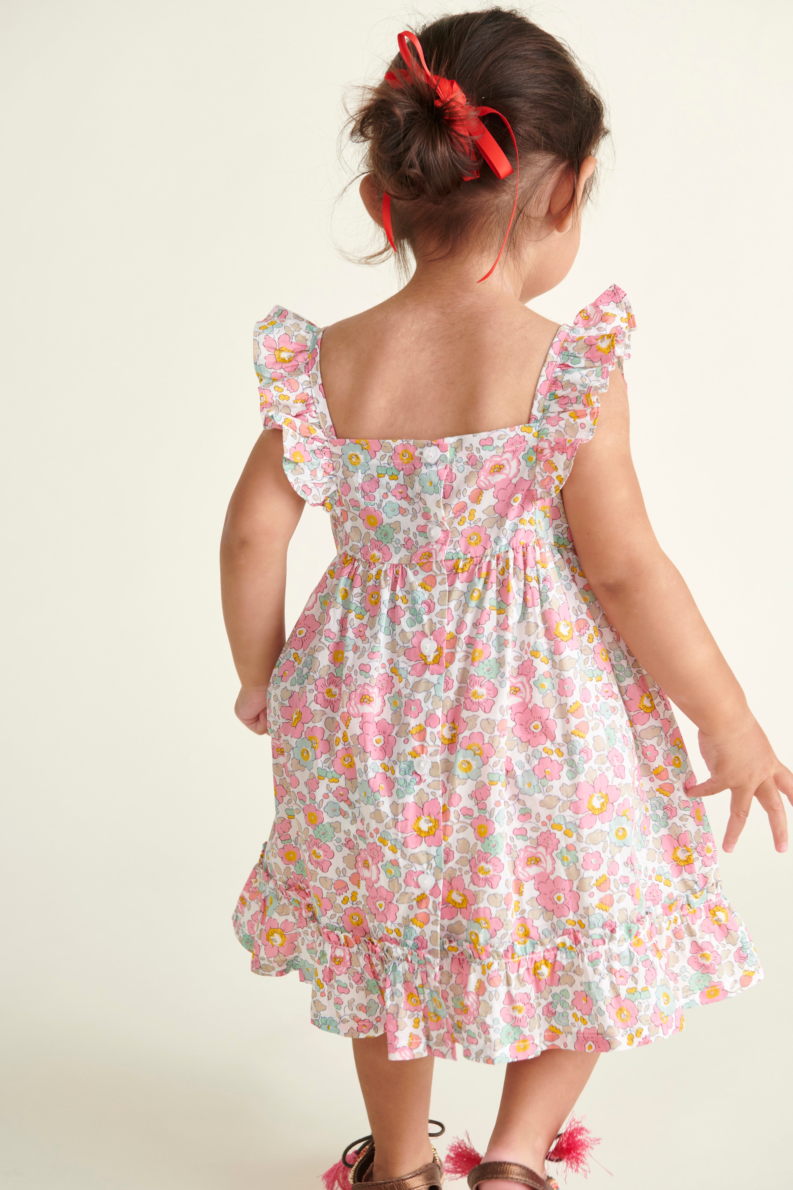 toddler girl in Liberty print sun dress, back