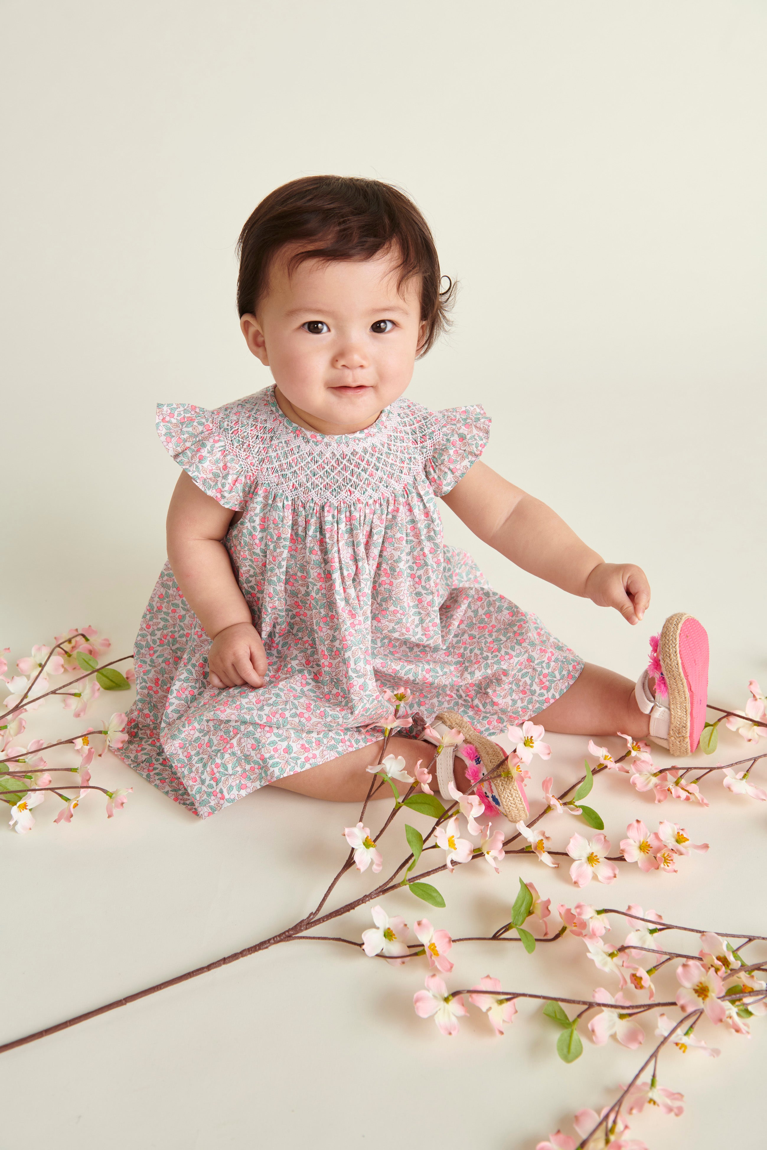 baby in Liberty fabric dress