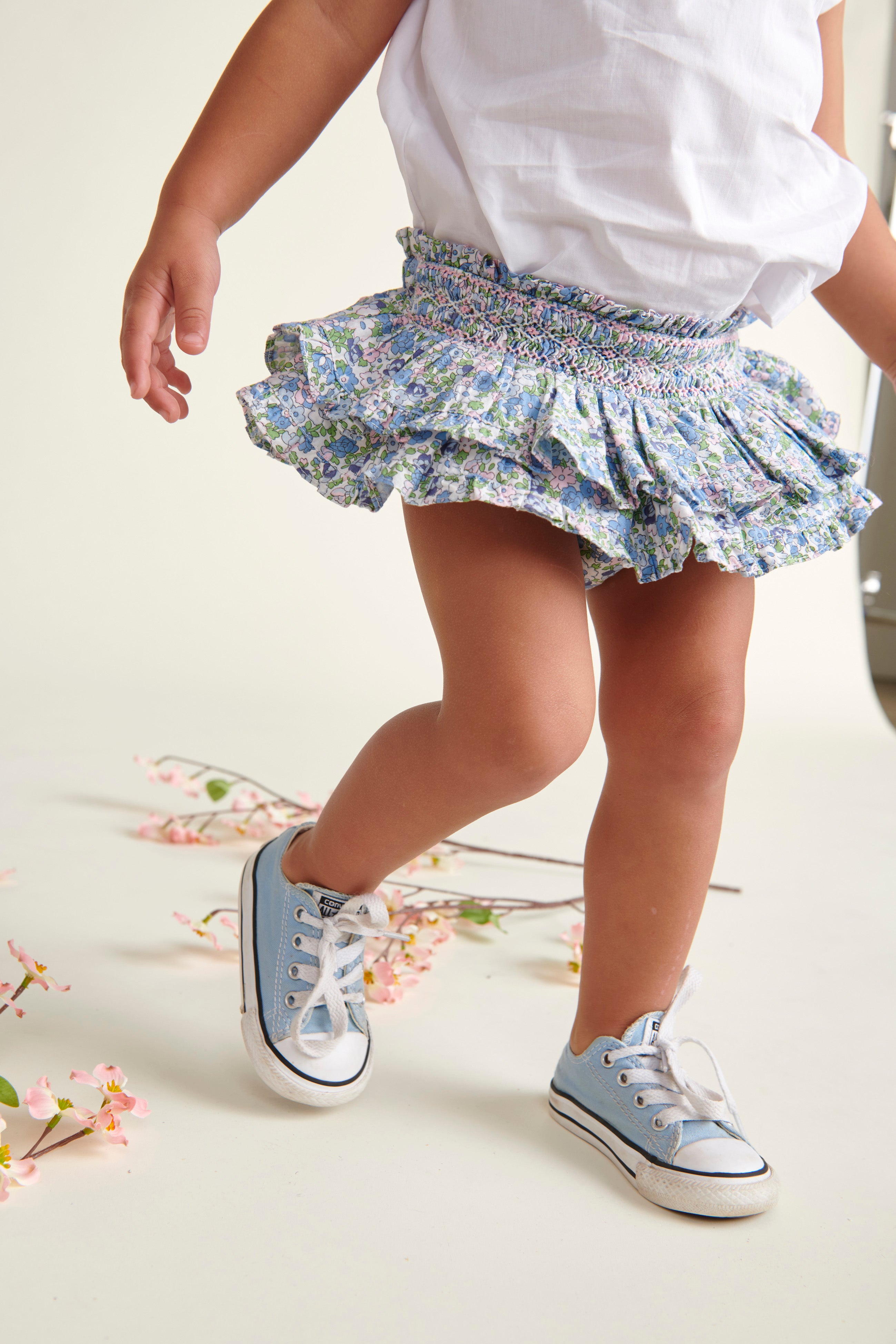 floral hand-smoked baby skort worn by toddler girl