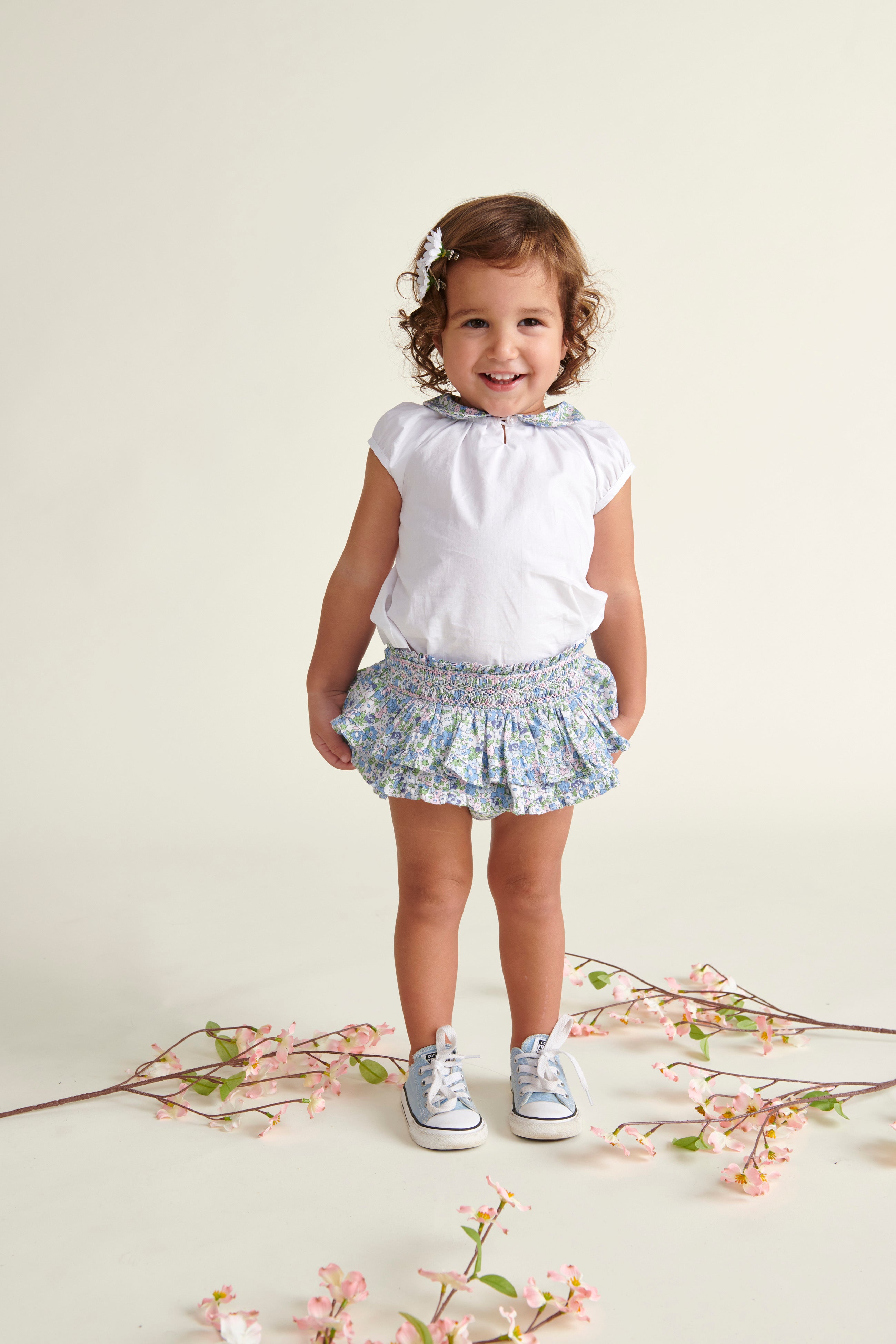 toddler in floral skort and blouse