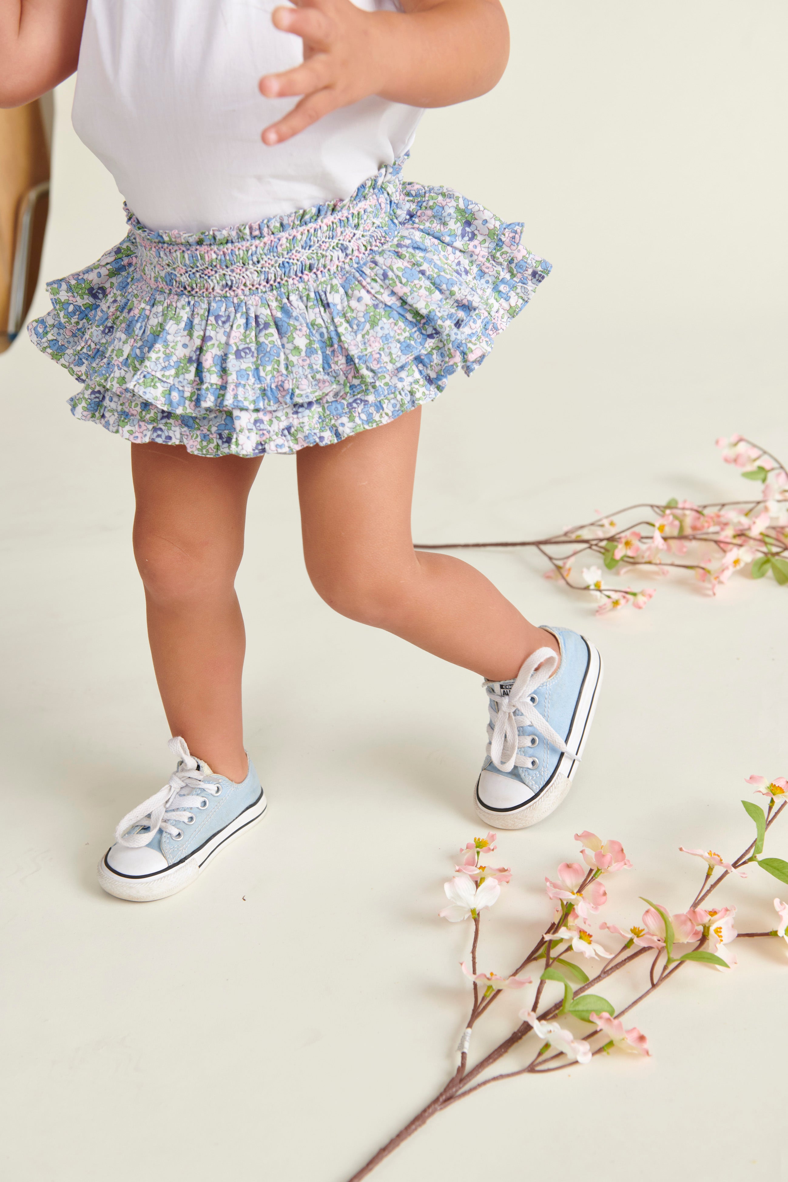 floral hand-smoked baby skort worn by toddler girl