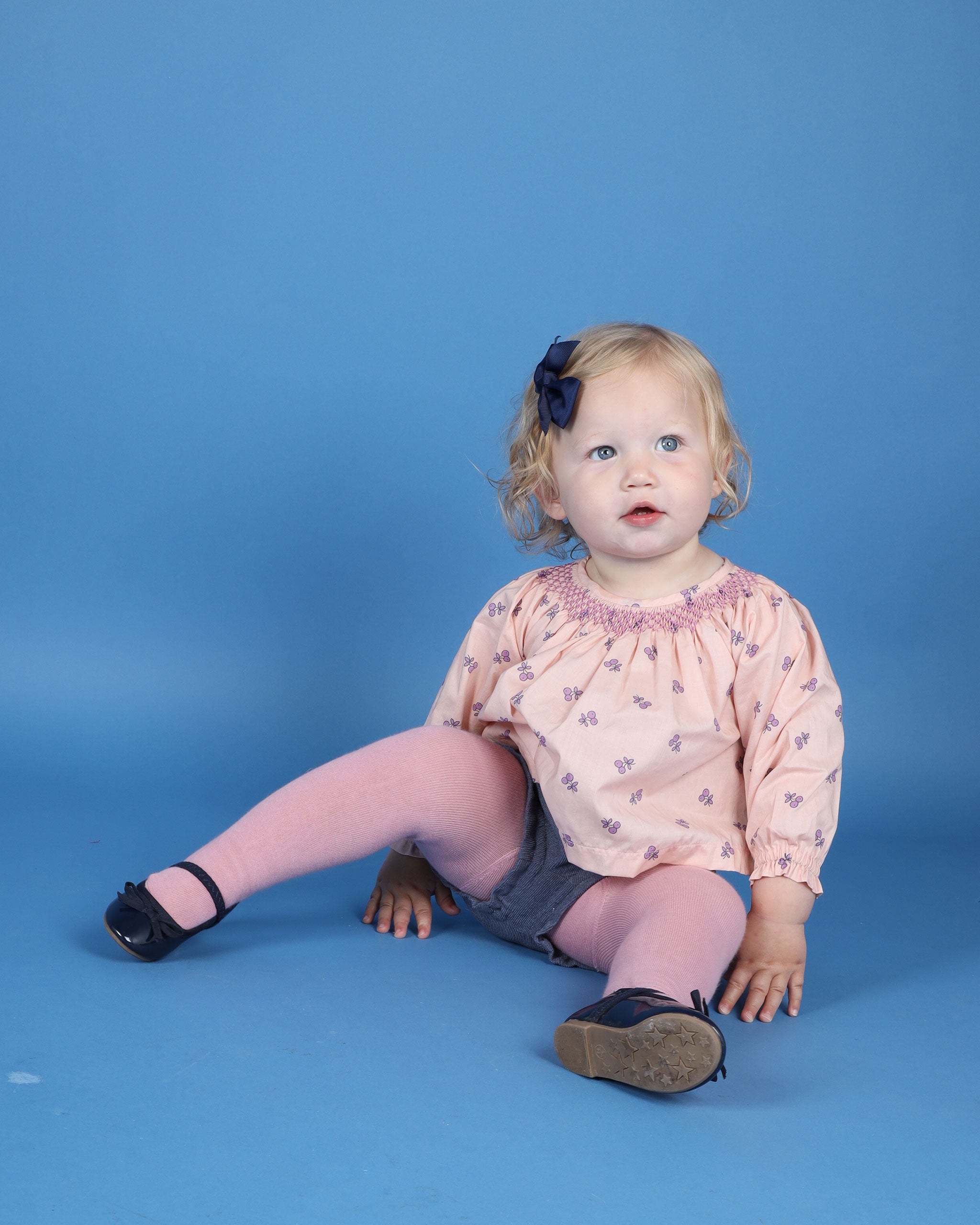 toddler girl in hand-smocked cherry print blouse