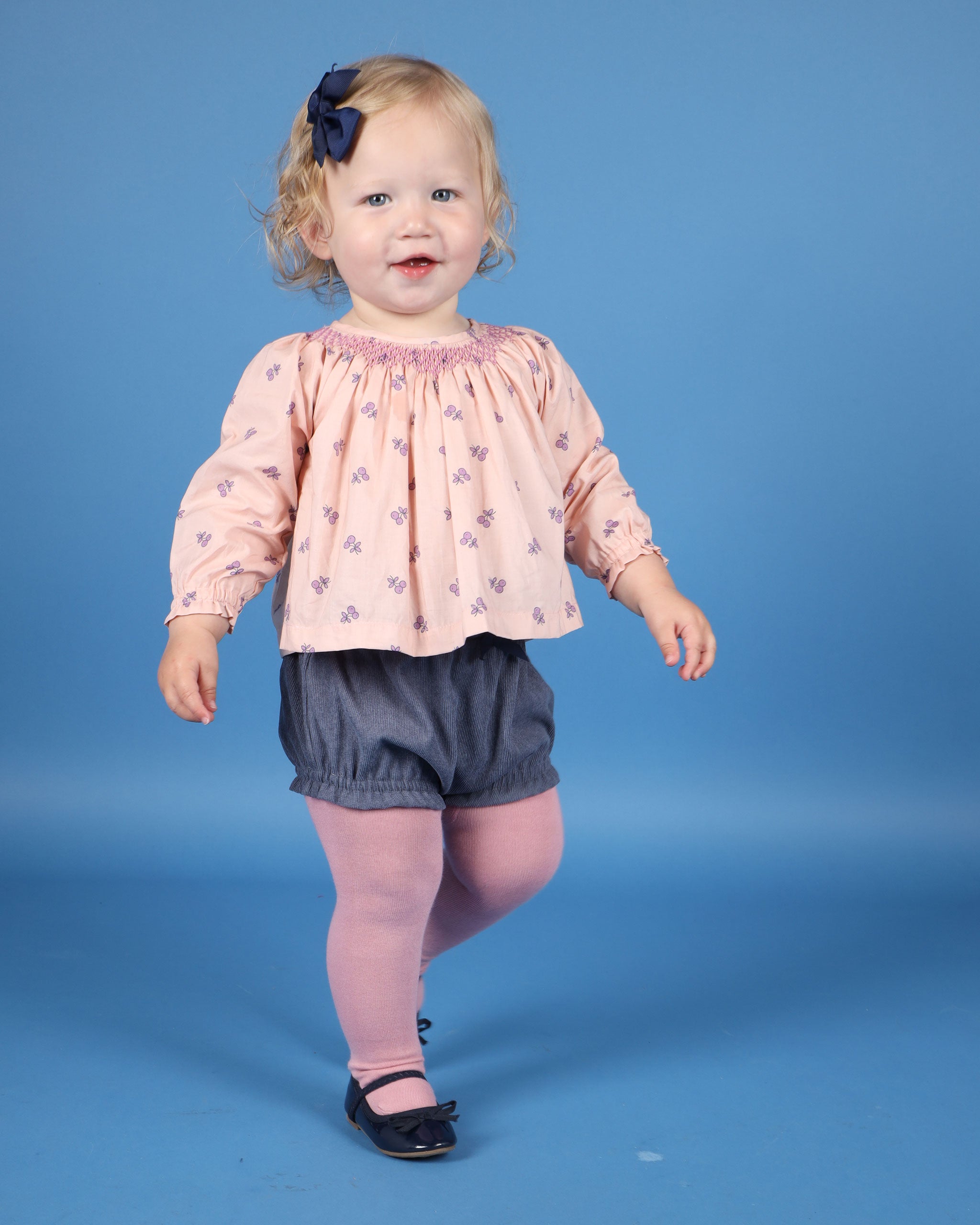 toddler in cute cherry print blouse