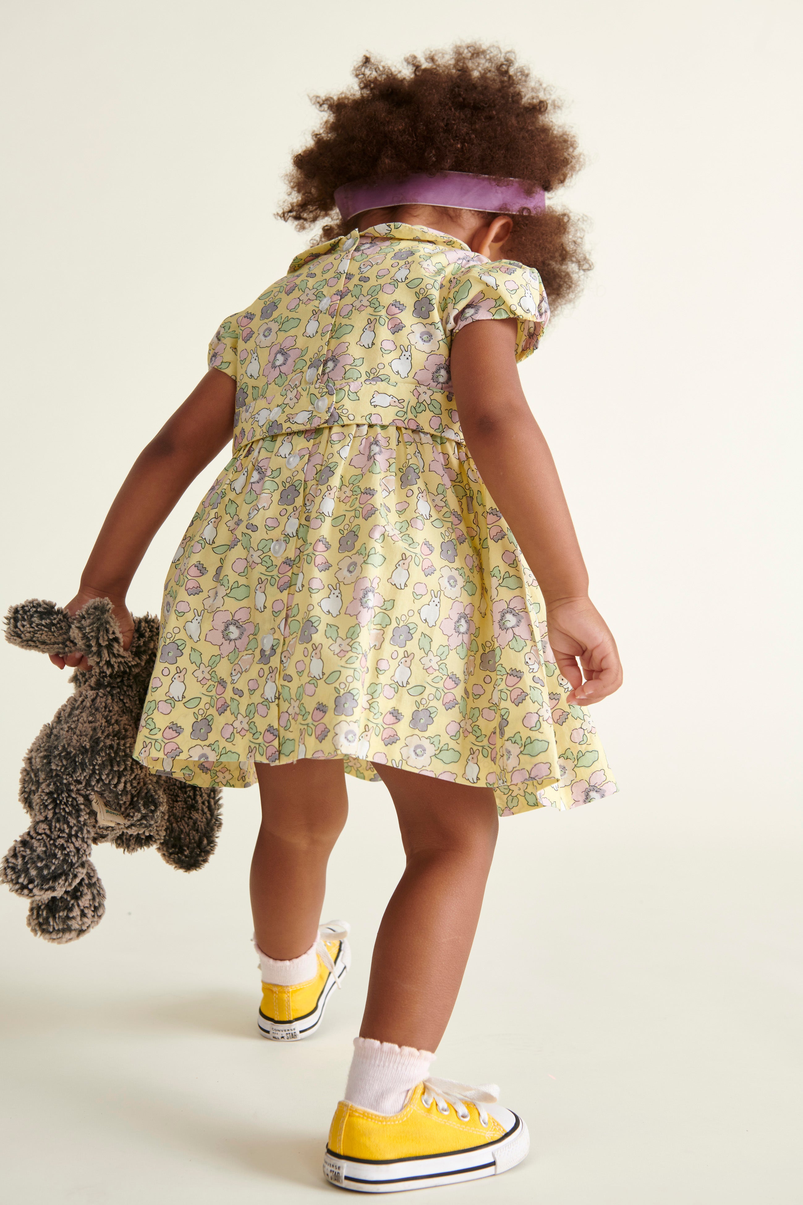 baby in bunny dress, back