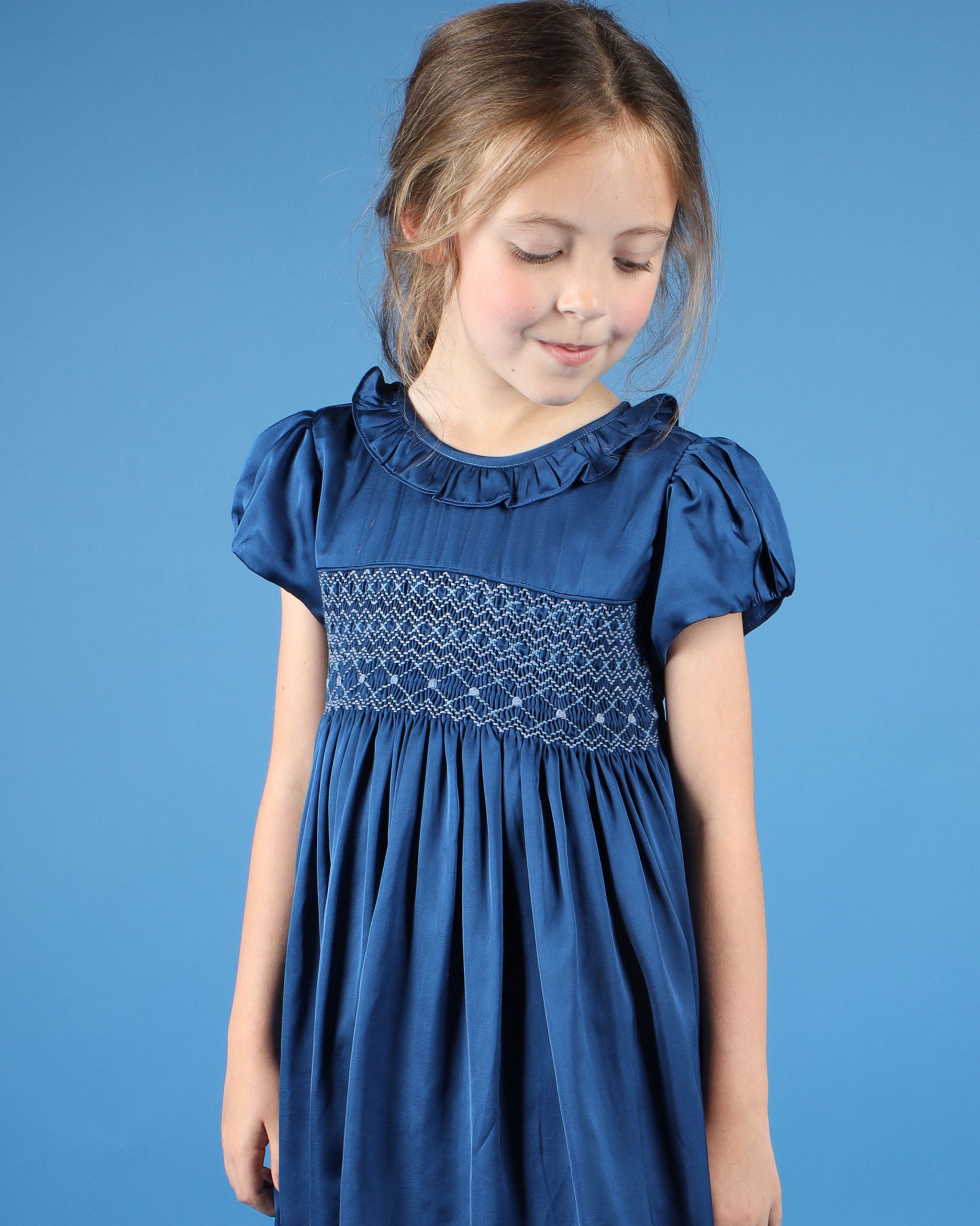 girl in hand-smocked party dress