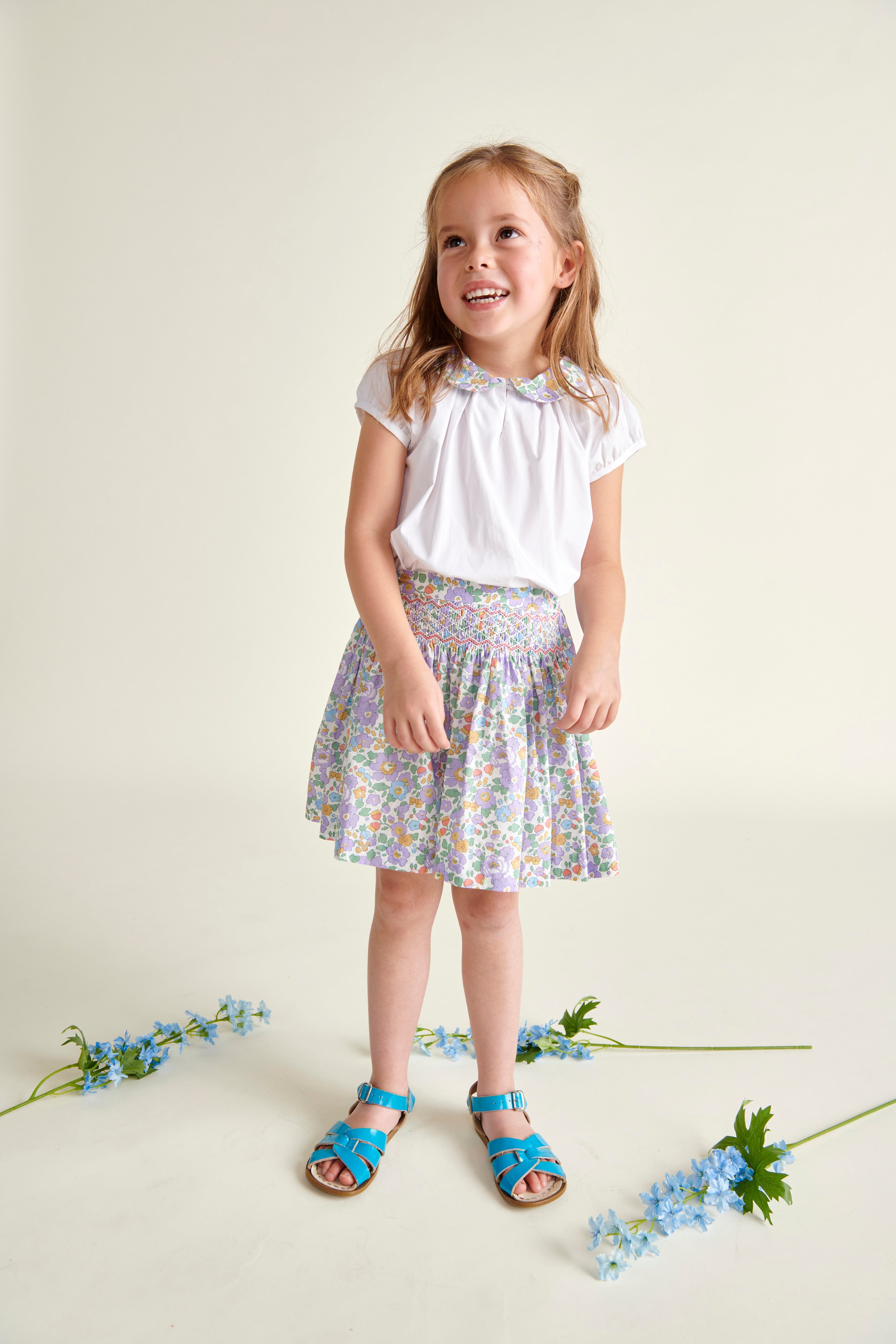 girl in smocked kirt with matching blouse