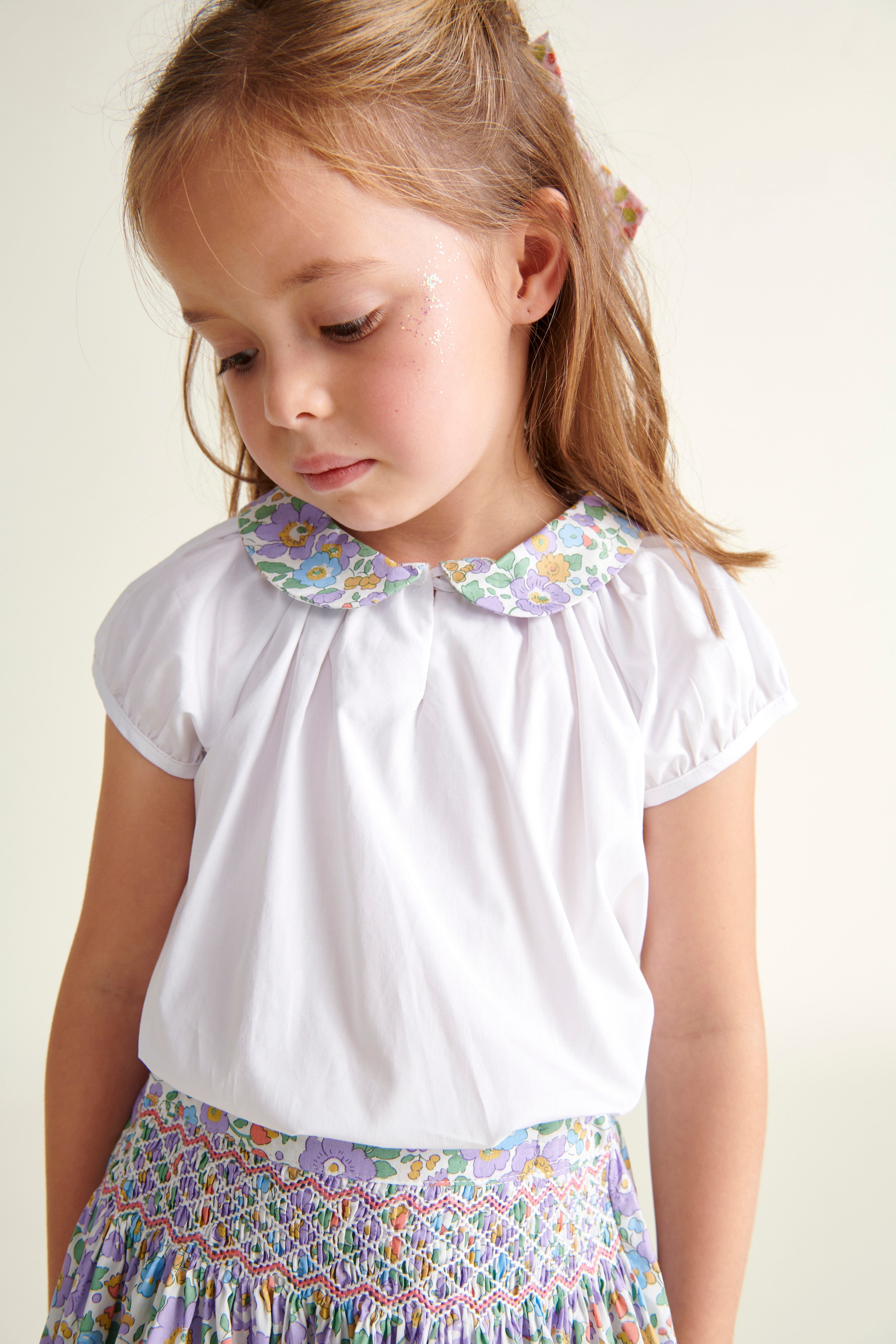 girl in white blouse with Liberty purple Betsy collar