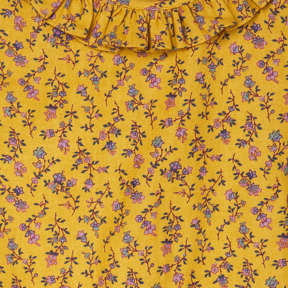 detail of yellow floral baby blouse